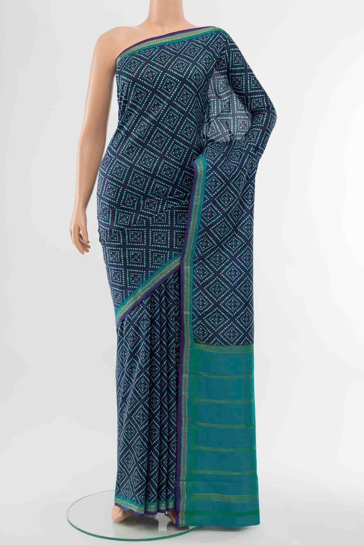 Navy Blue Printed Silk Saree with Floral Print on the body and Fancy Border displayed on a mannequin
