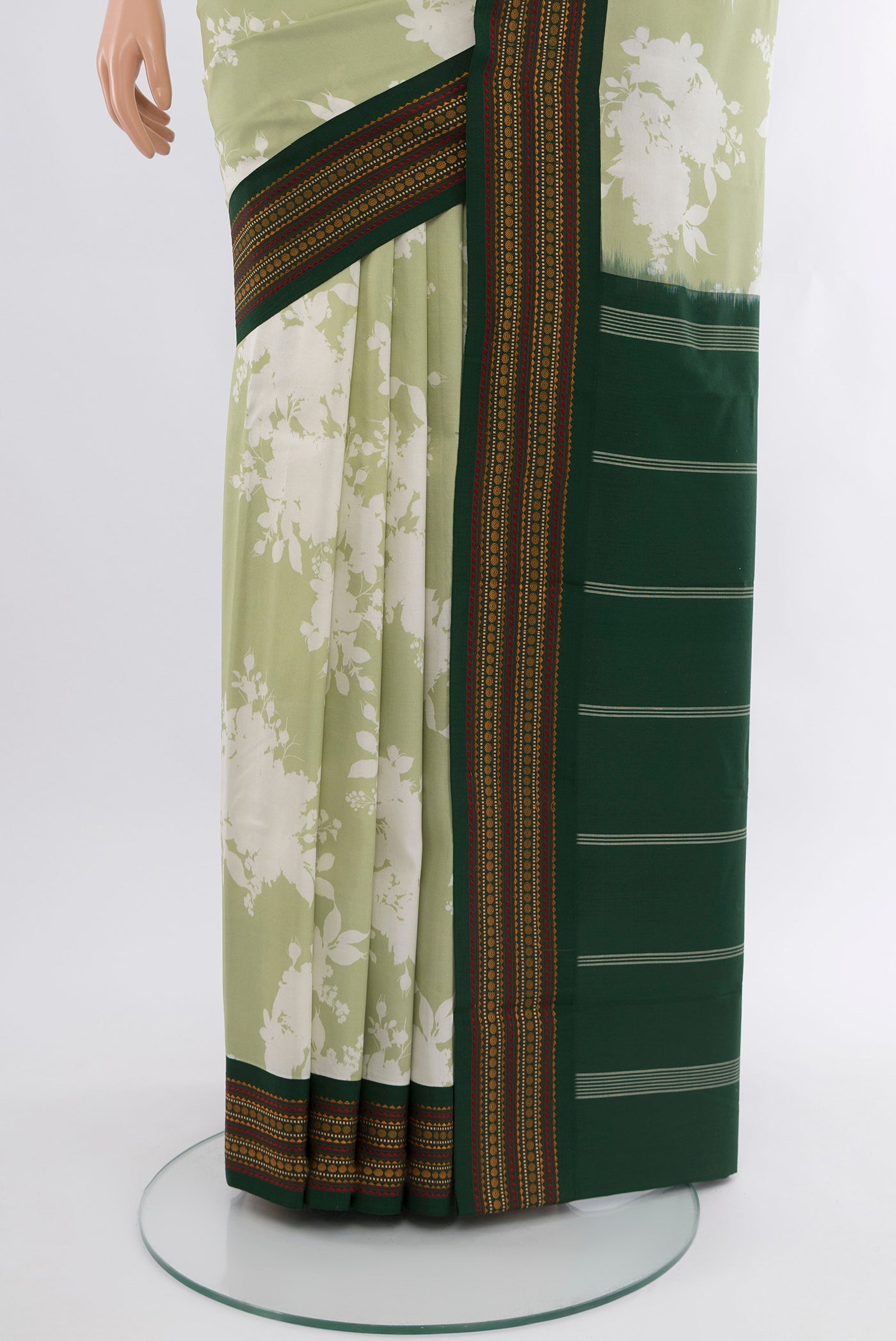 Pleats and pallu of Pista Green Printed Silk Saree with Floral Print on the body and Zari Border. 