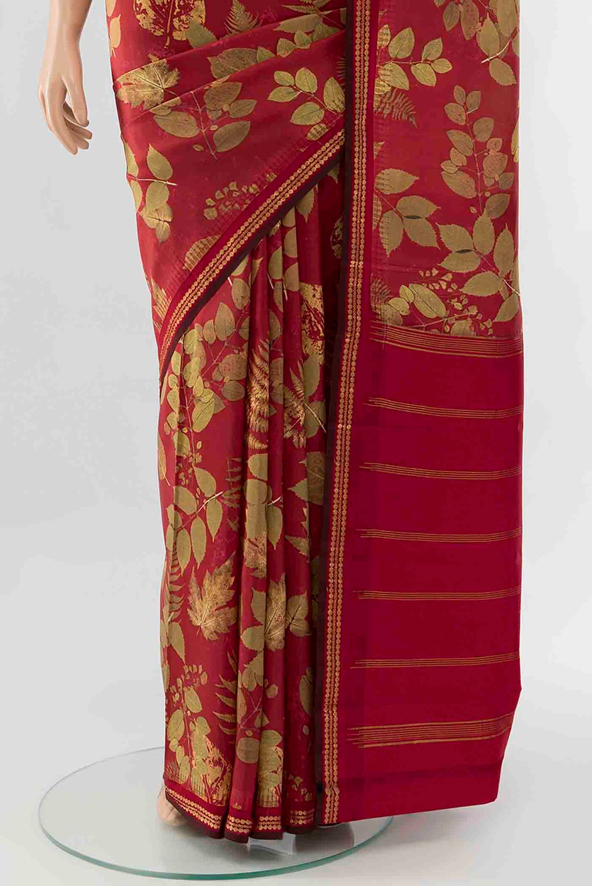 Pleats and pallu of Maroon Printed Silk Saree with Floral Print on the body and Fancy Border