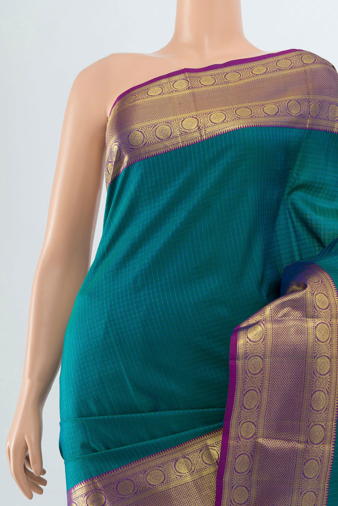 Border image of Peacock Blue Kanjivaram Silk Saree with Zari Butta on the body and Silk Border. 