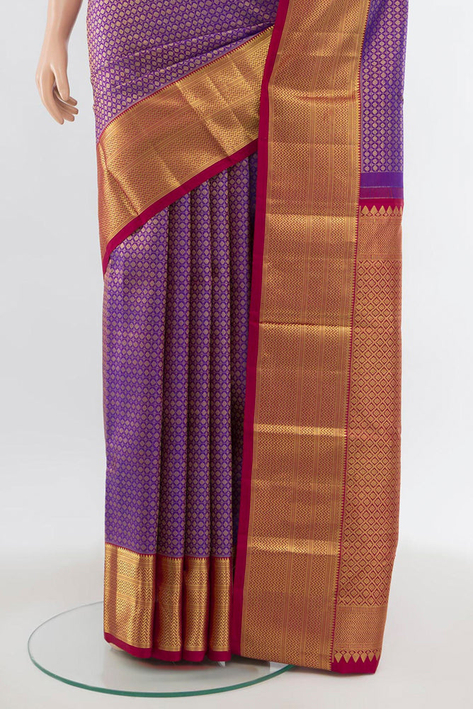 Pleats and pallu of Purple Kanjivaram Silk Saree with Zari Brocade on the body and Silk Border. 