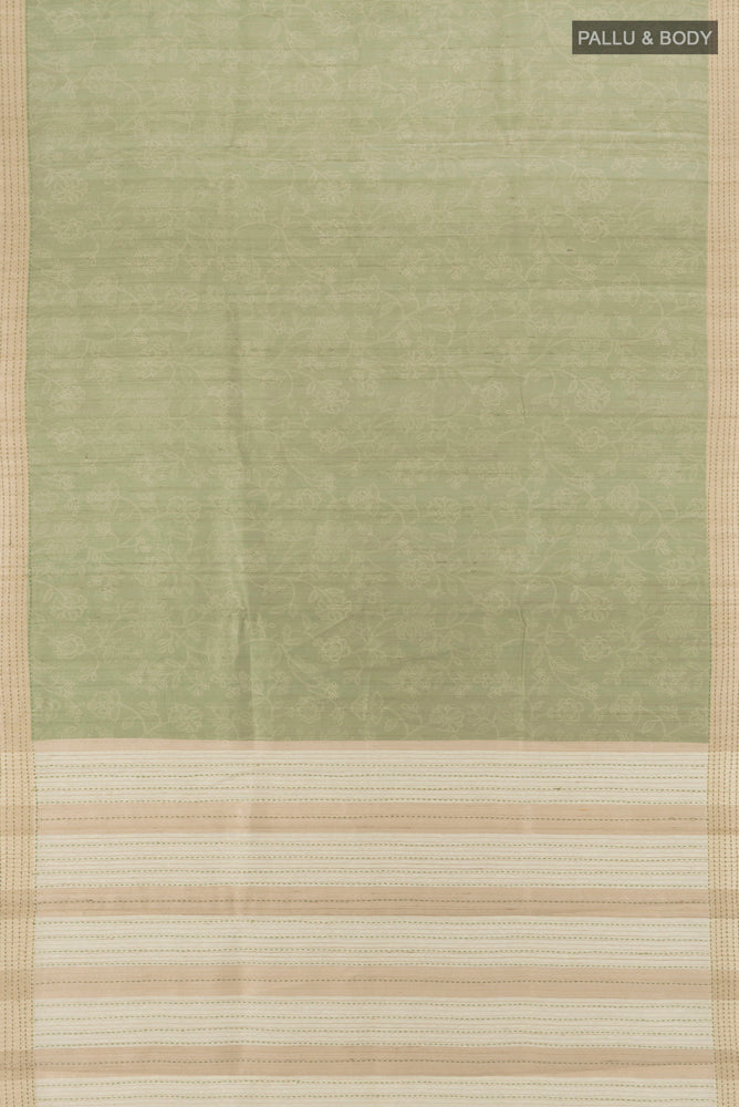 Flat view of Pure Silk Pure Zari Pista Green Tussar Saree with Floral Print on the body and Silk Border. 