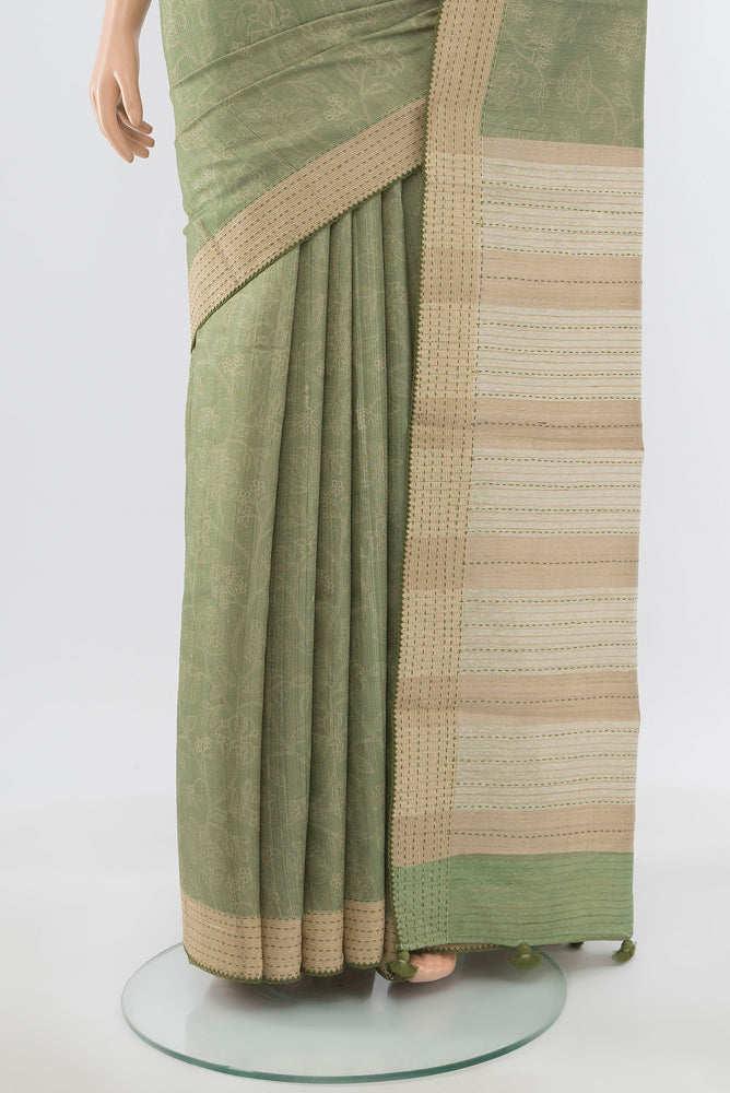 Pleats and pallu of Pure Silk Pure Zari Pista Green Tussar Saree with Floral Print on the body and Silk Border. 