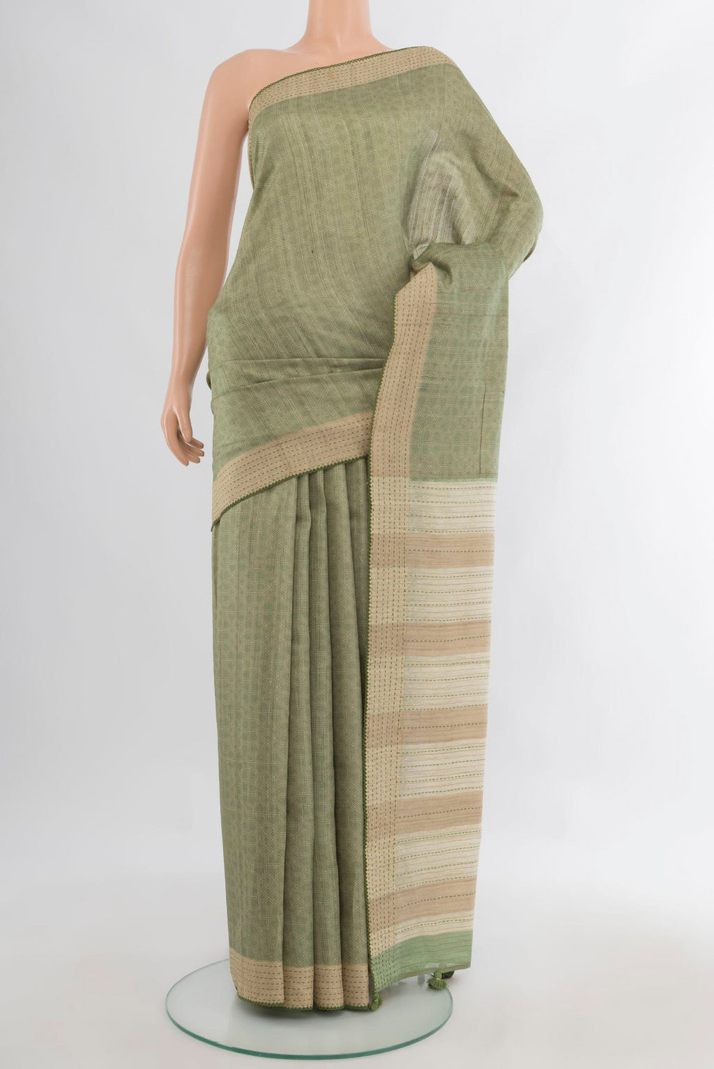 Sage Green Tussar Saree with Embroidery on the body and Embroidery Border.  displayed on a mannequin