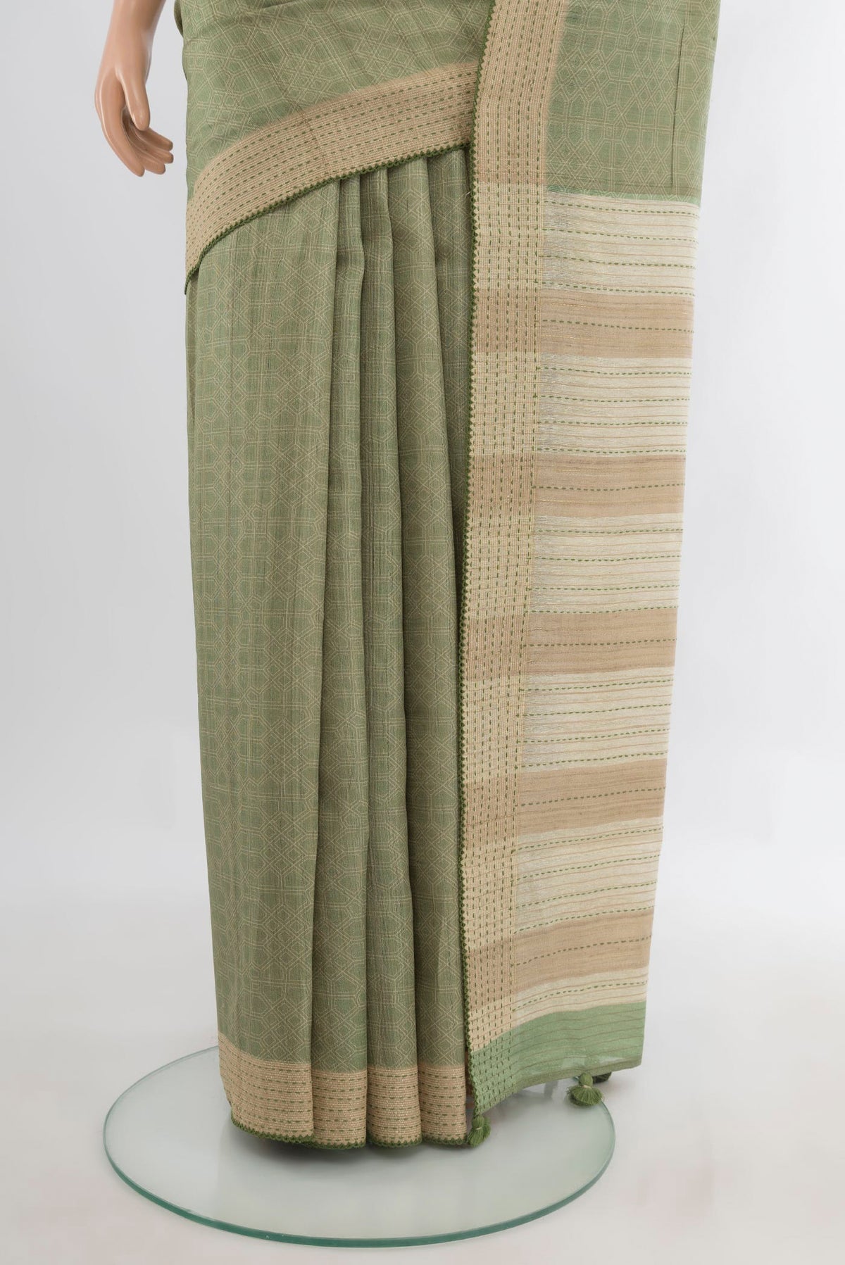 Pleats and pallu of Sage Green Tussar Saree with Embroidery on the body and Embroidery Border. 