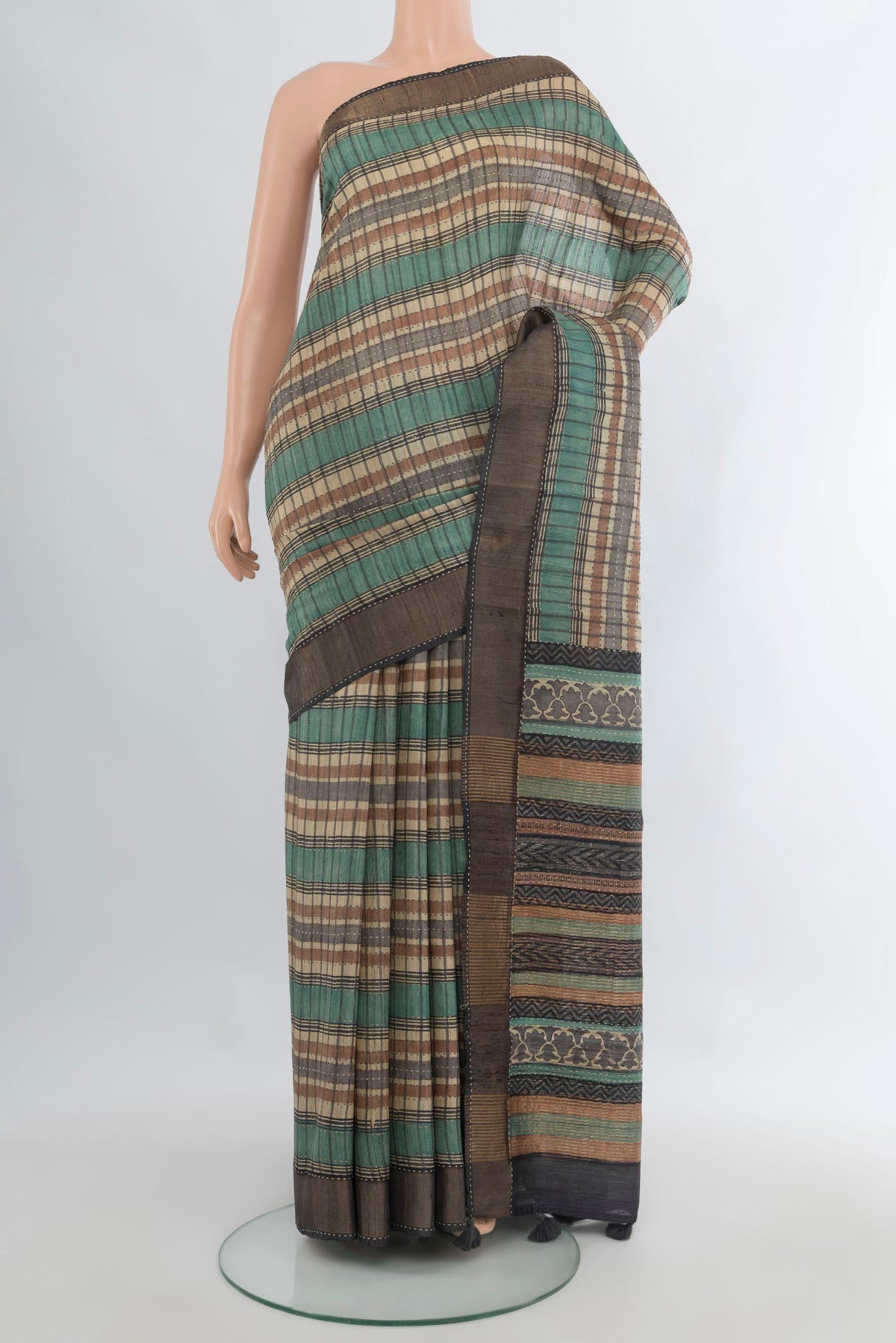 Multi Color Tussar Saree with Printed design on the body and Zari Border.  displayed on a mannequin