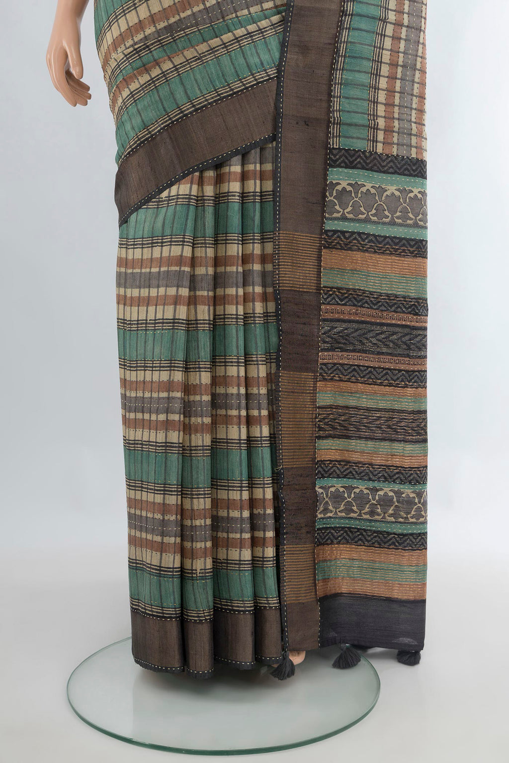 Pleats and pallu of Multi Color Tussar Saree with Printed design on the body and Zari Border. 