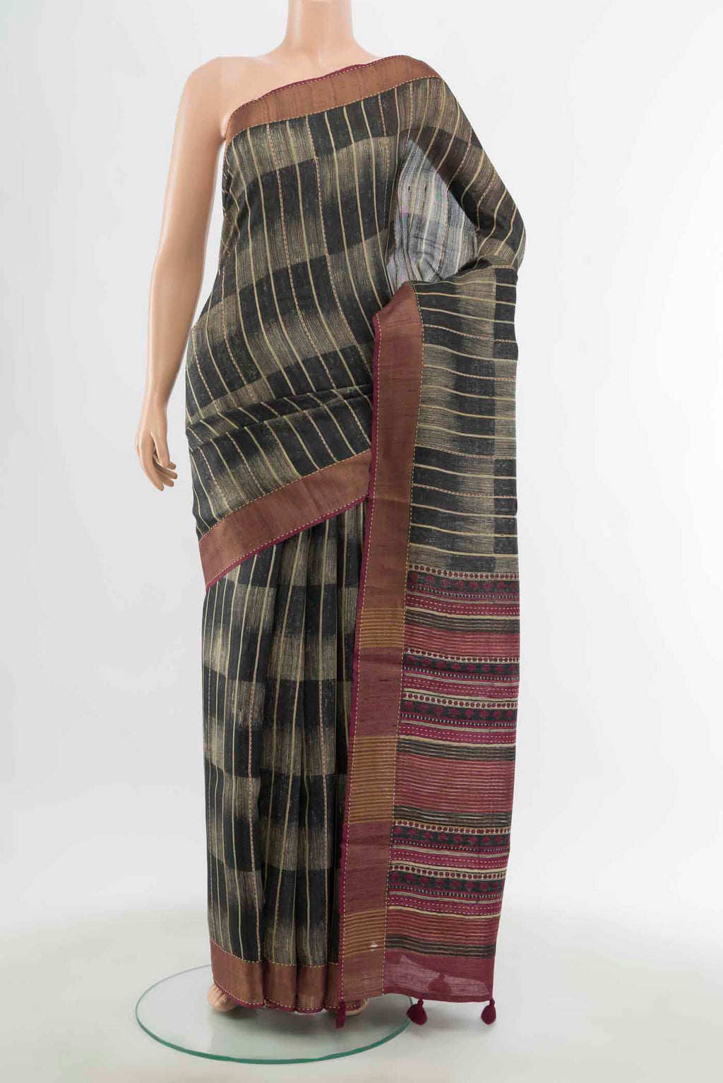 Black Tussar Silk Saree with Zari Butta on the body and Silk Border displayed on a mannequin