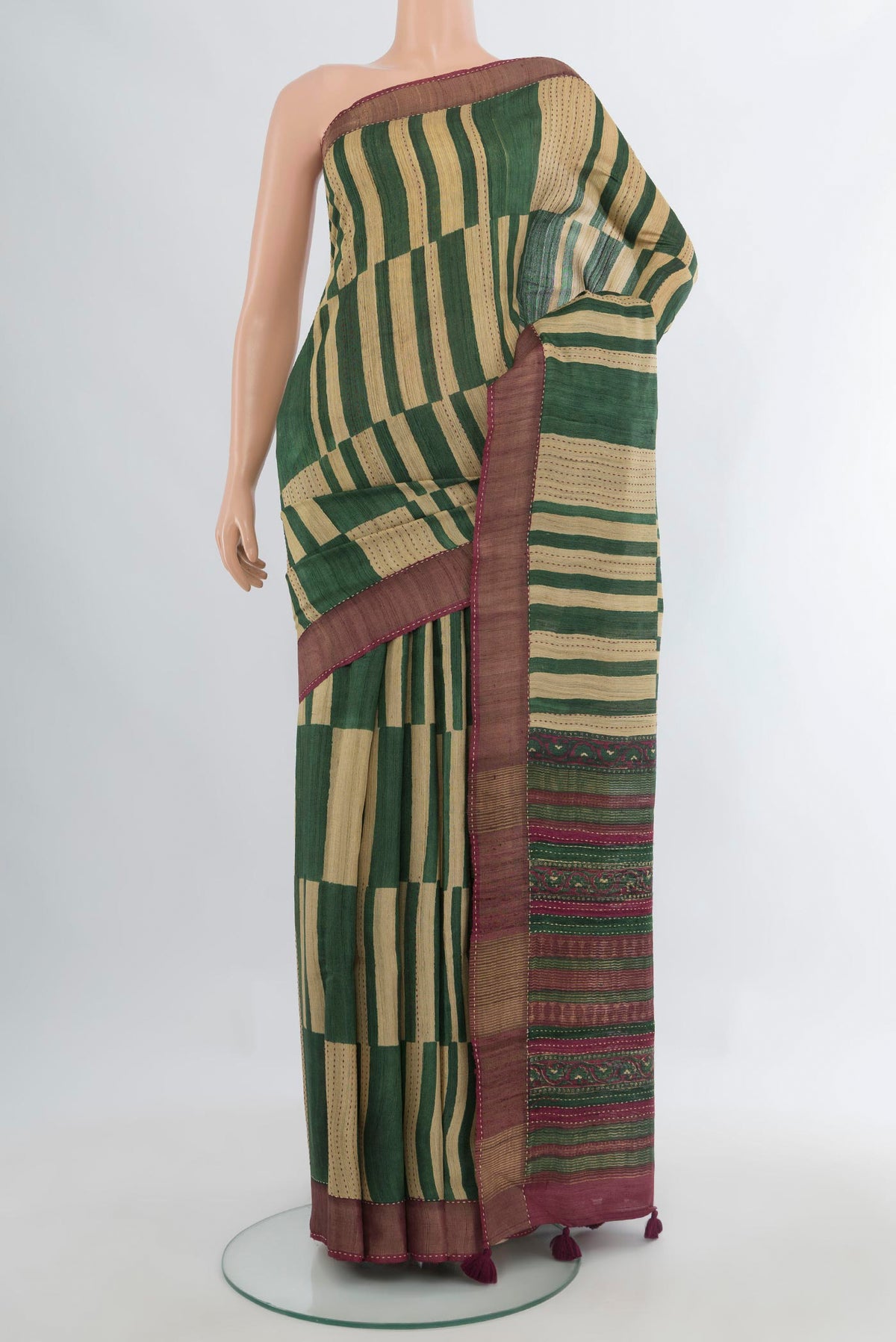 Multi Color Tussar Saree with Floral Print on the body and Zari Border.  displayed on a mannequin
