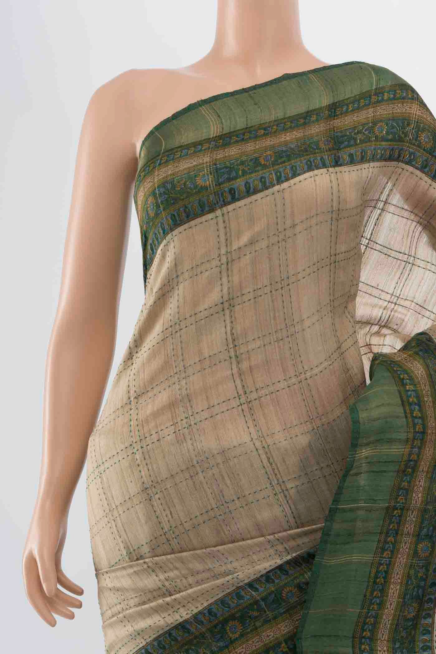 Border image of Beige Tussar Silk Saree with Embroidery on the body and Thread Border