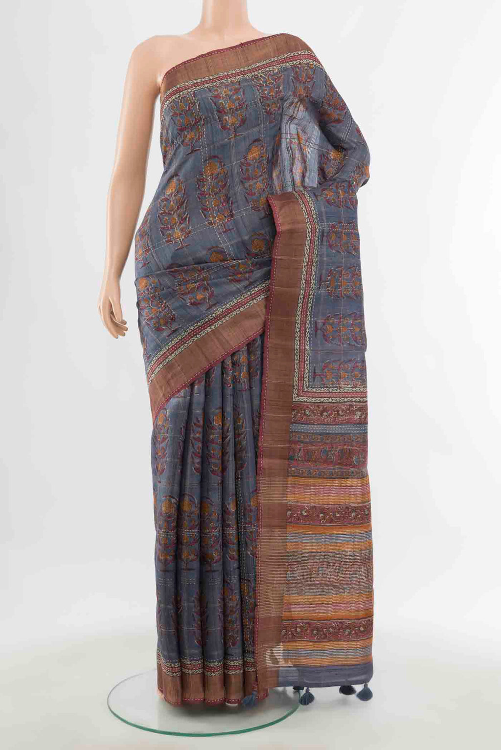 Grey Tussar Silk Saree with Zari Butta on the body and Silk Border displayed on a mannequin