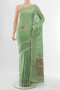 Pista Green Art Silk Saree with Thread Butta on the body and Thread Border displayed on a mannequin
