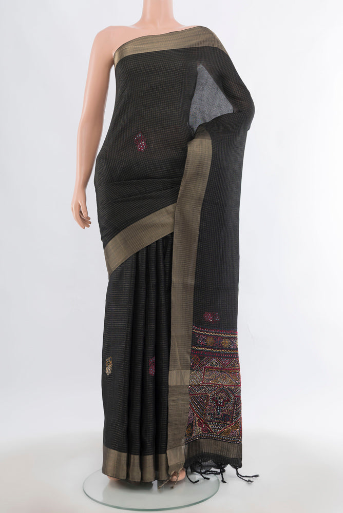Black Art Silk Saree with Checked design on the body and Silk Border.  displayed on a mannequin