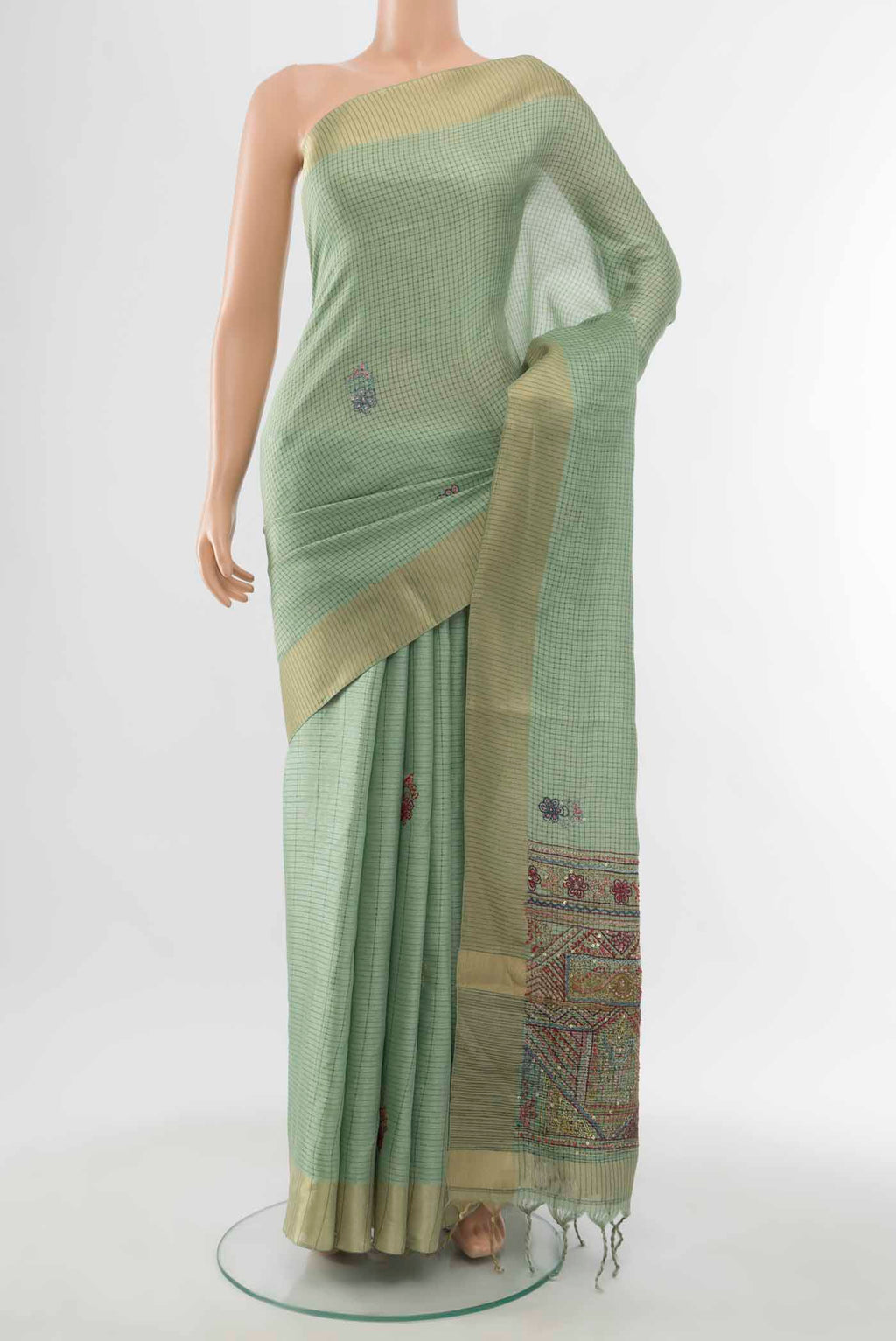 Pista Green Art Silk Saree with Zari Butta on the body and Silk Border displayed on a mannequin