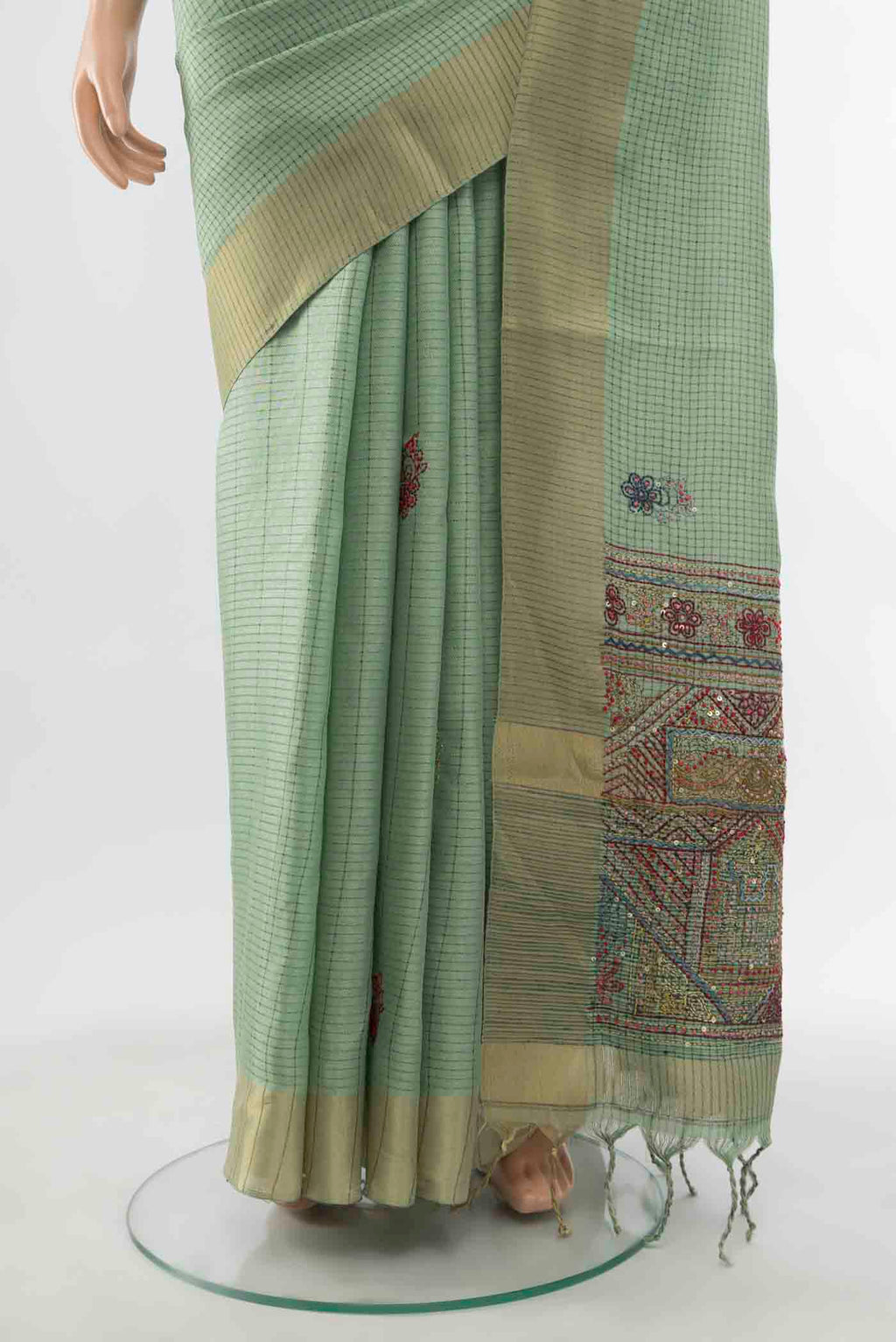 Pleats and pallu of Pista Green Art Silk Saree with Zari Butta on the body and Silk Border