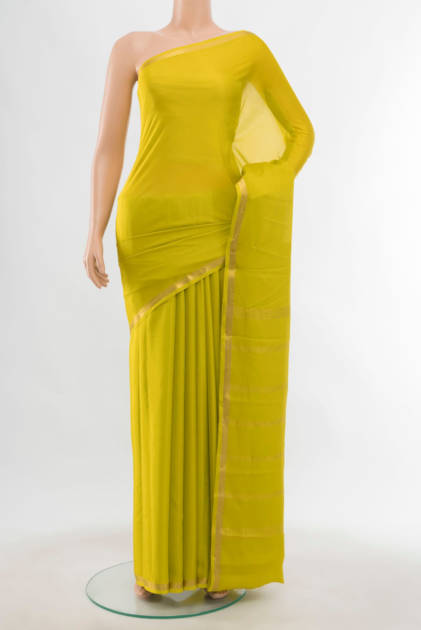 Parrot Green Mysore Crepe Saree with Zari Butta on the body and Silk Border displayed on a mannequin