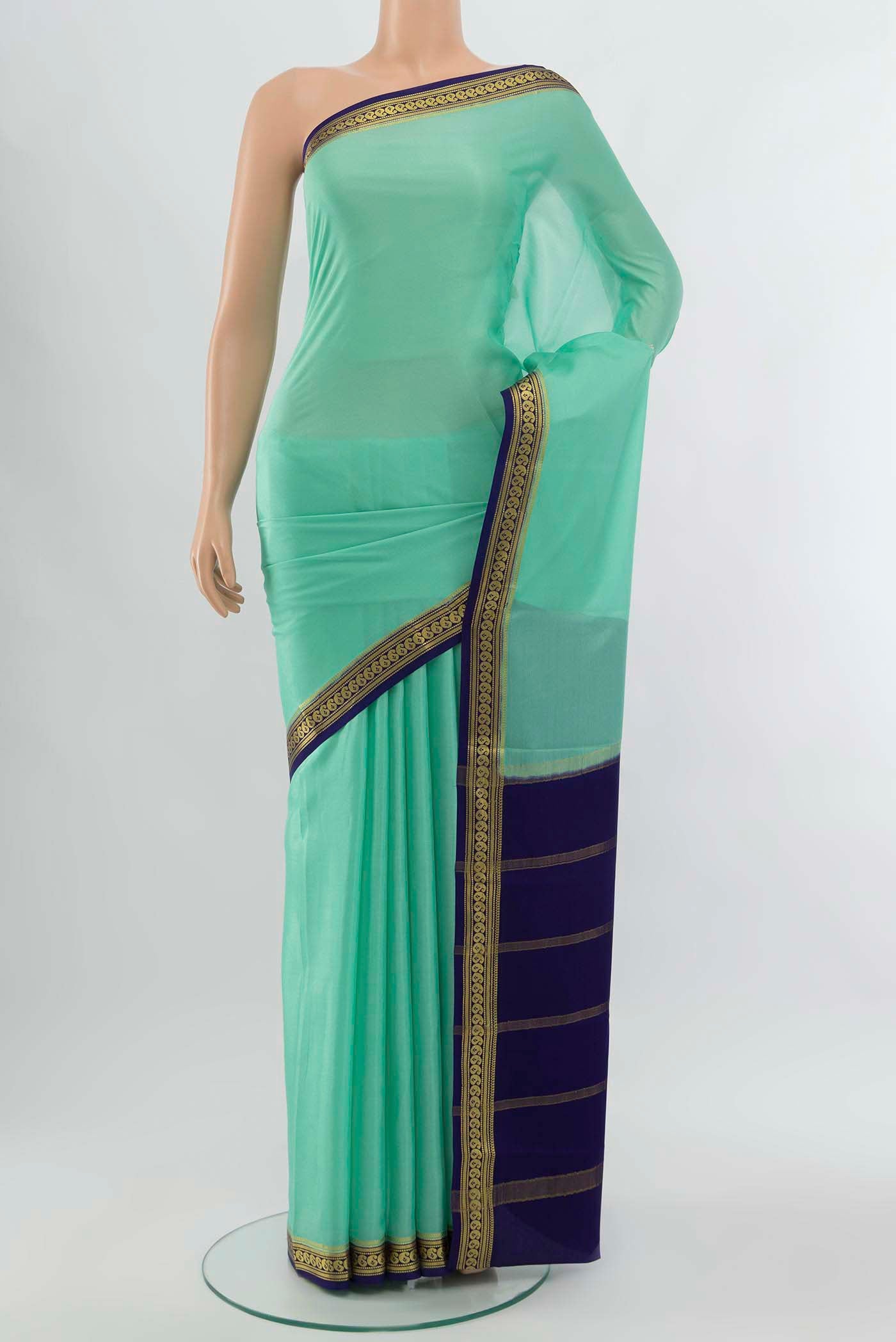 Teal Mysore Crepe Saree with Zari Brocade on the body and Silk Border displayed on a mannequin