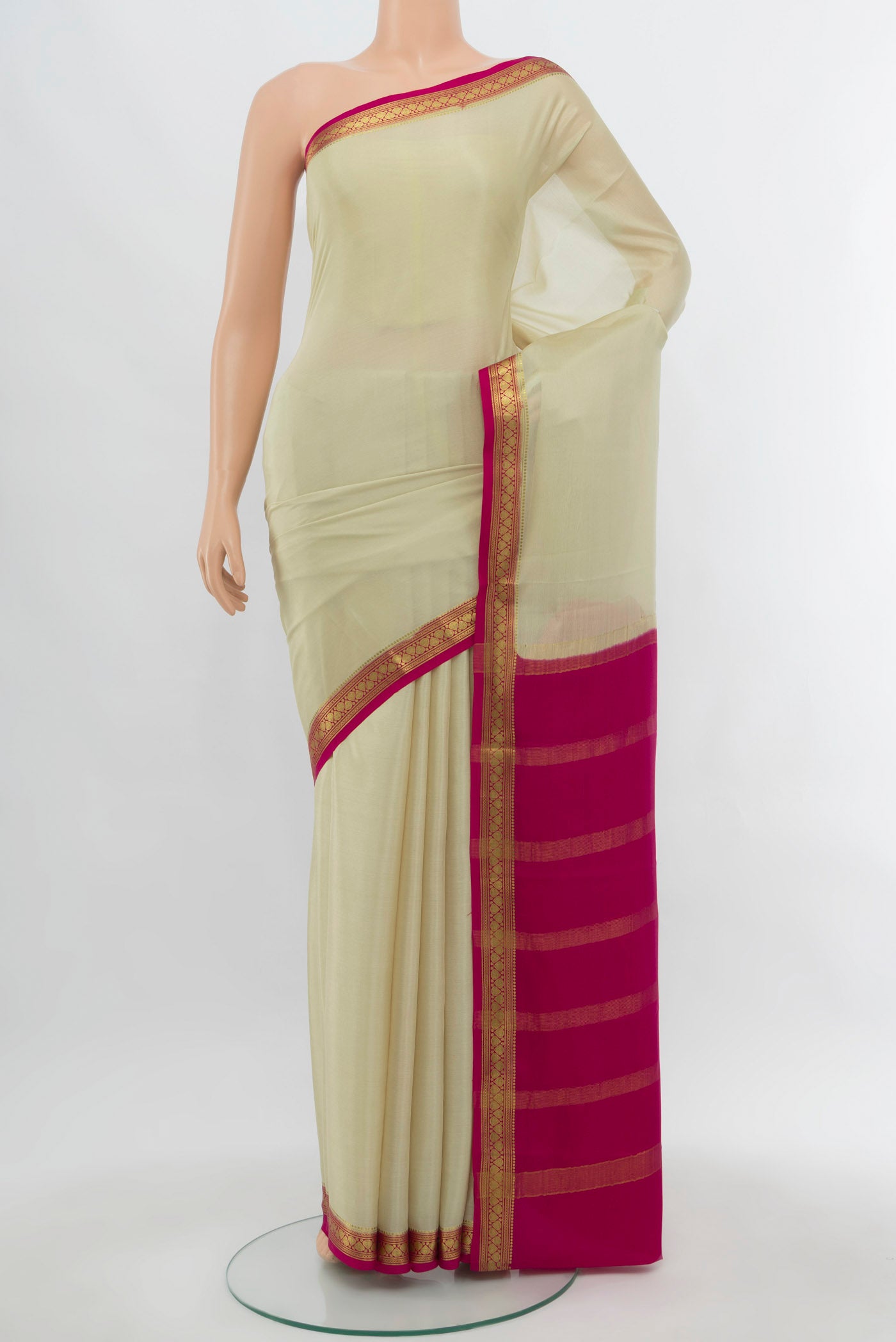 Cream Mysore Crepe Saree with Plain Body and Silk Border.  displayed on a mannequin