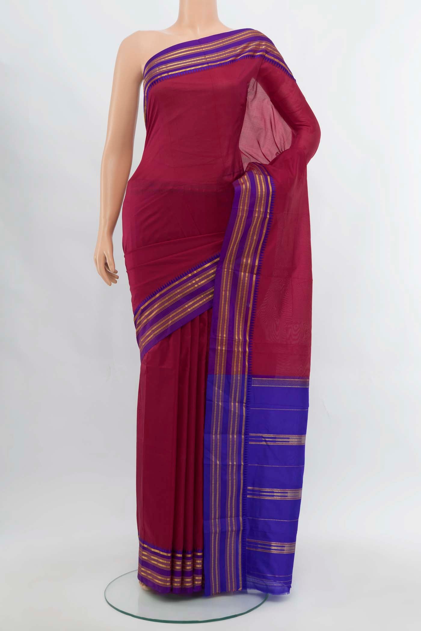 Maroon Narayanpet Silk Saree with Zari Butta on the body and Silk Border.  displayed on a mannequin