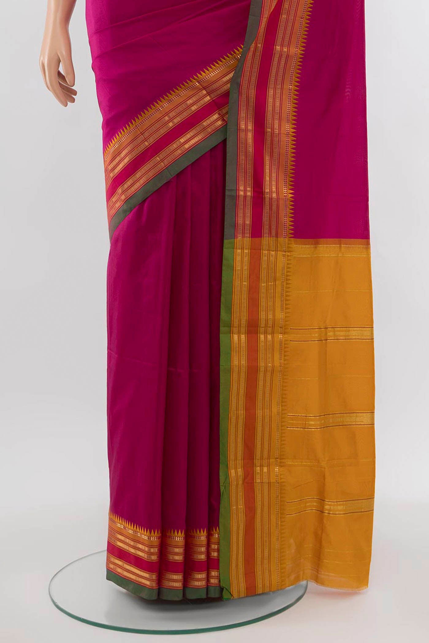 Pleats and pallu of Dark Pink Narayanpet Silk Saree with Zari Butta on the body and Zari Border. 