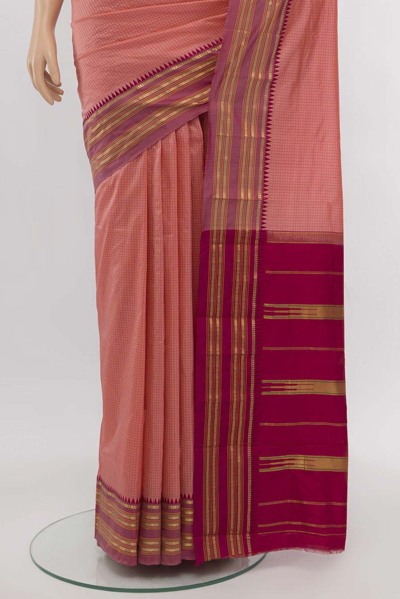 Pleats and pallu of Peach Narayanpet Silk Saree with Zari Butta on the body and Silk Border. 