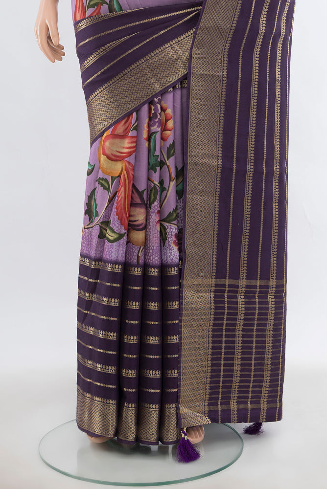 Pleats and pallu of Lavender Art Silk Saree with Floral Print on the body and Silk Border. 