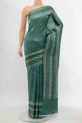 Light Green Tussar Silk Saree with Floral Print on the body and Silk Border displayed on a mannequin