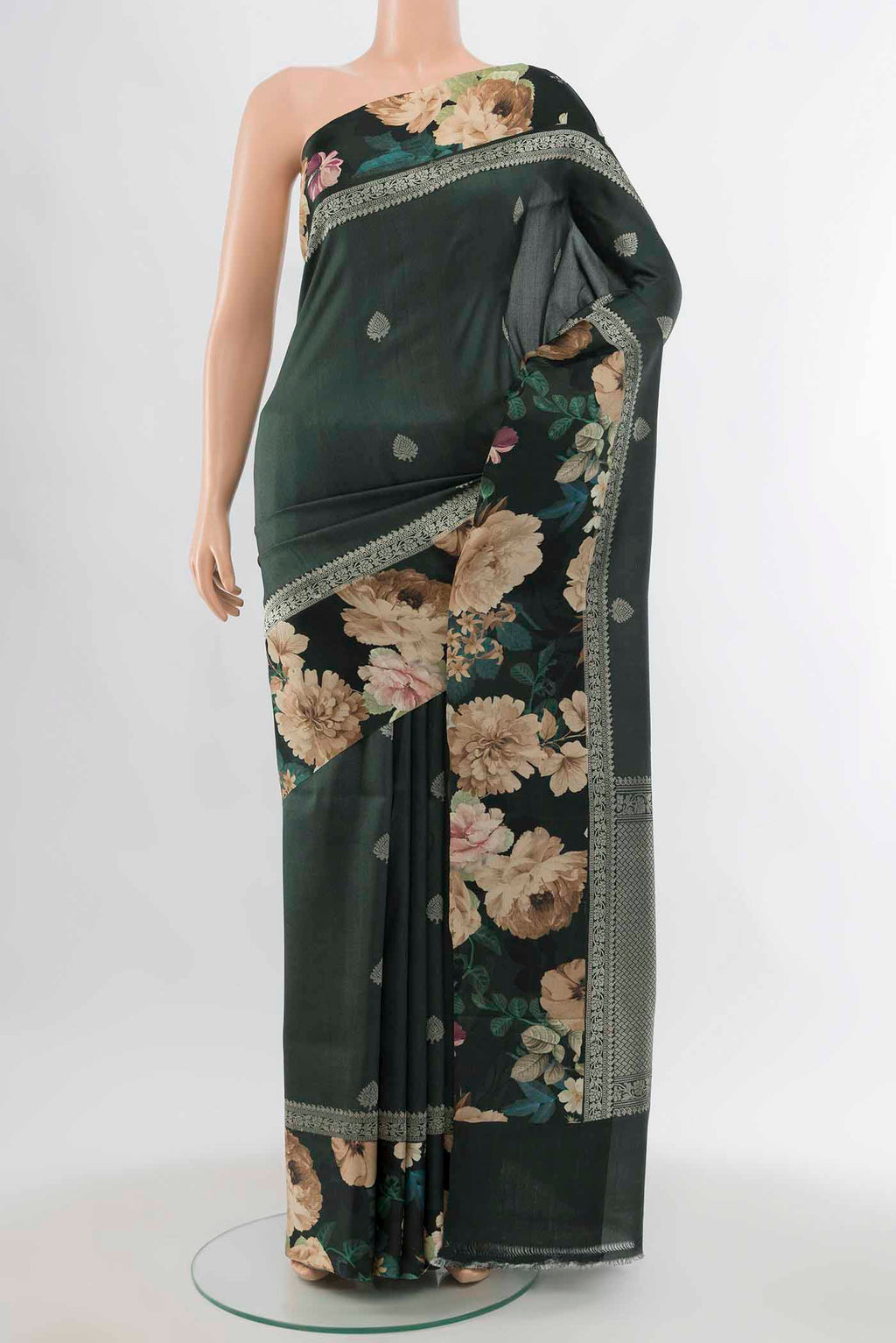 Bottle Green Tussar Silk Saree with Zari Butta on the body and Fancy Border displayed on a mannequin