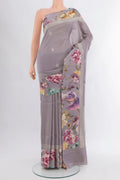 Davys Grey Tussar Silk Saree with Zari Butta on the body and Fancy Border.  displayed on a mannequin