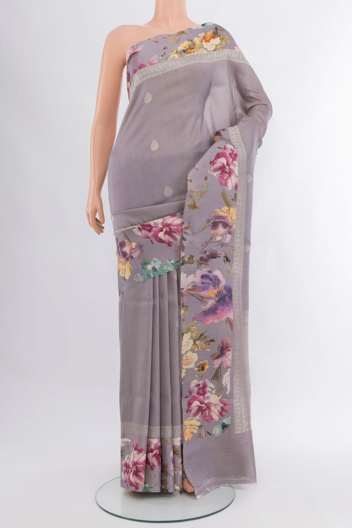 Davys Grey Tussar Silk Saree with Zari Butta on the body and Fancy Border.  displayed on a mannequin