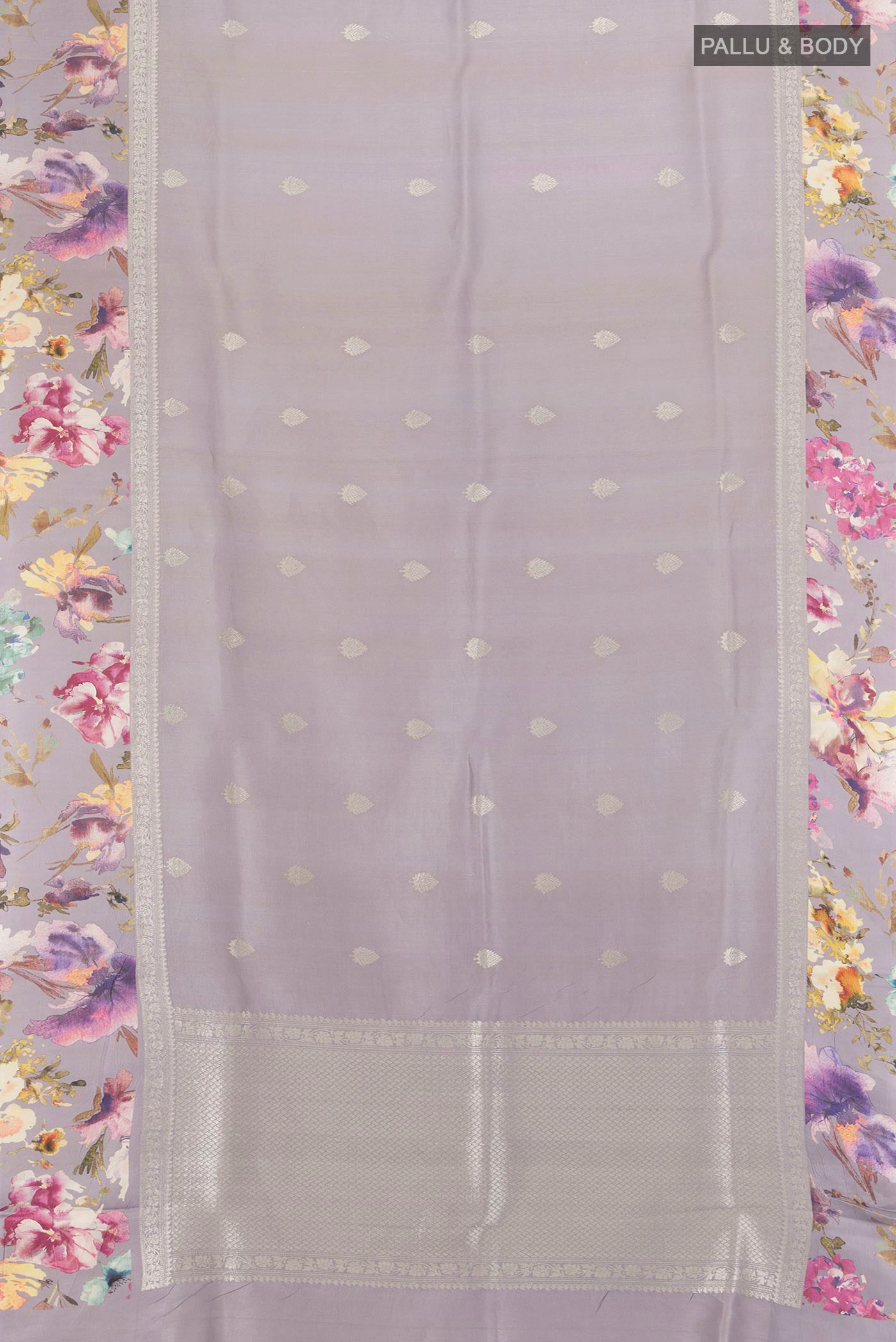 Flat view of Davys Grey Tussar Silk Saree with Zari Butta on the body and Fancy Border. 