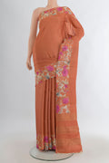 Rust Tussar Saree with Stripes on the body and Printed Border.  displayed on a mannequin