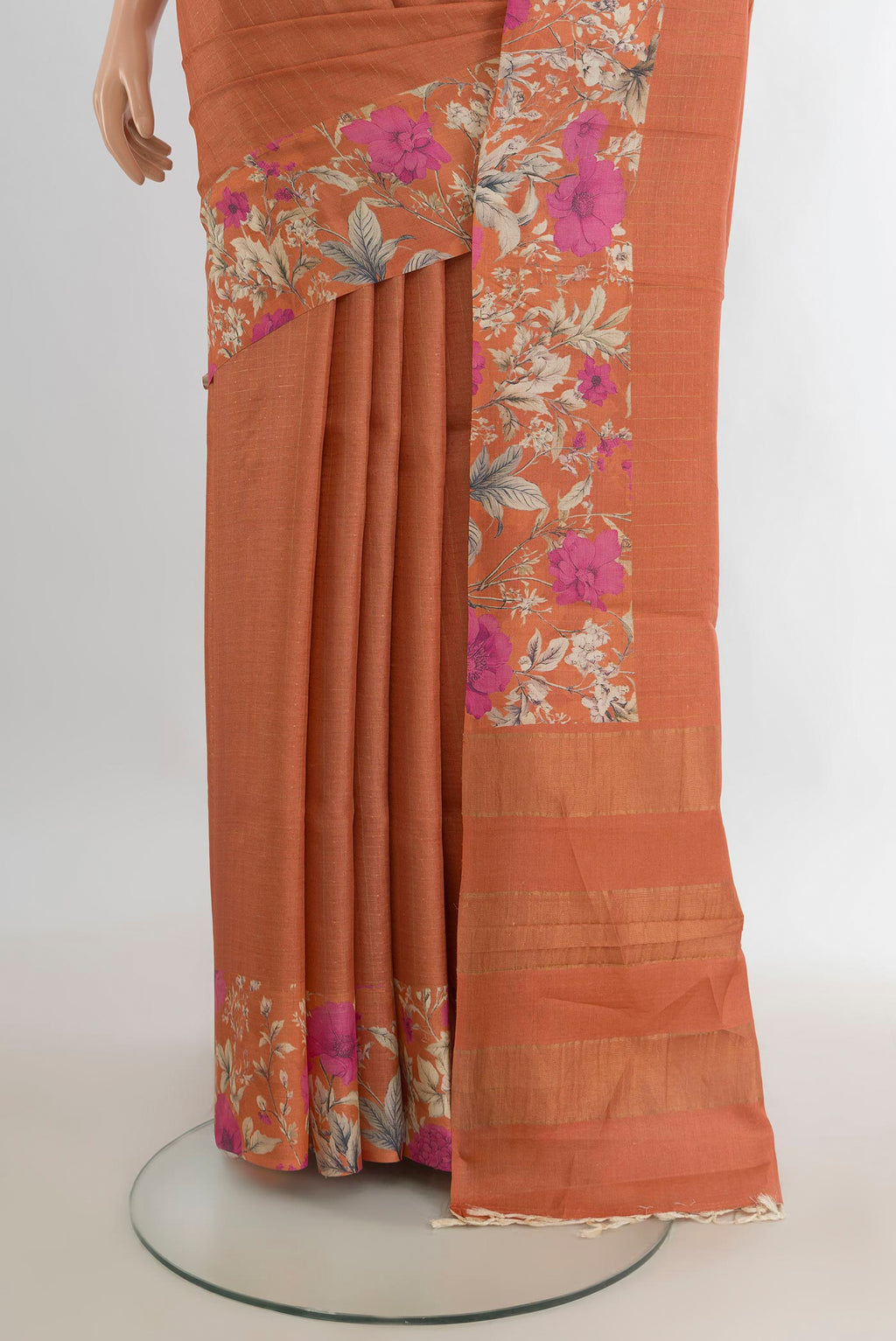 Pleats and pallu of Rust Tussar Saree with Stripes on the body and Printed Border. 