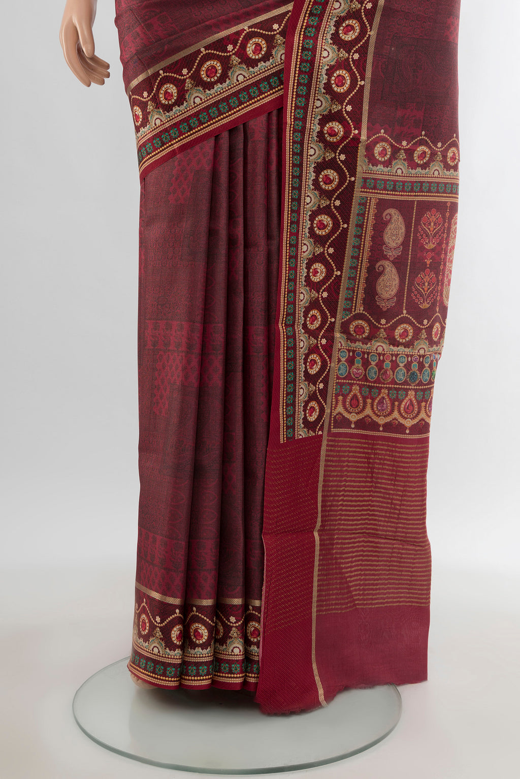 Pleats and pallu of Brown Tussar Silk Saree with Printed design on the body and Printed Border. 
