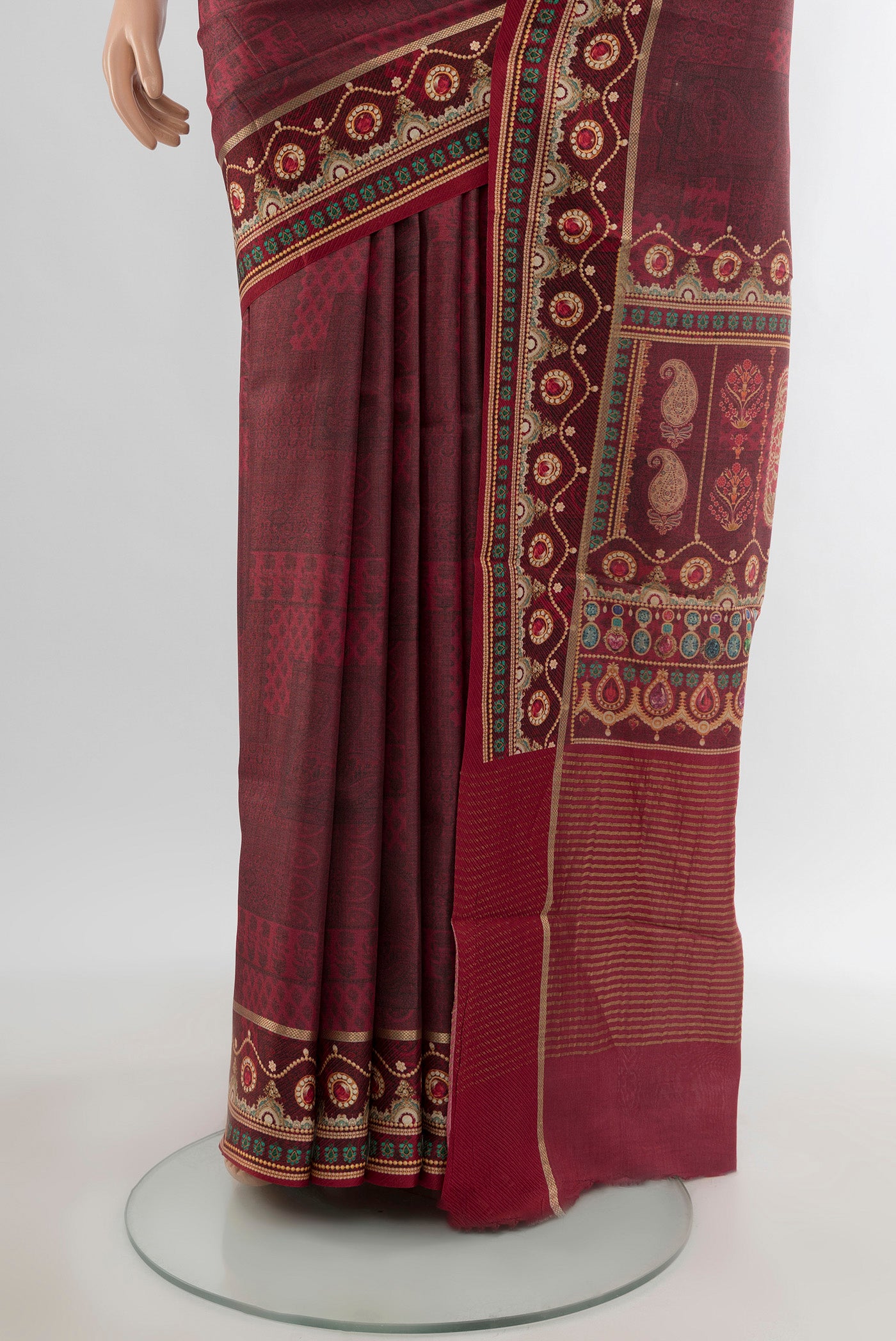 Pleats and pallu of Brown Tussar Silk Saree with Printed design on the body and Printed Border. 