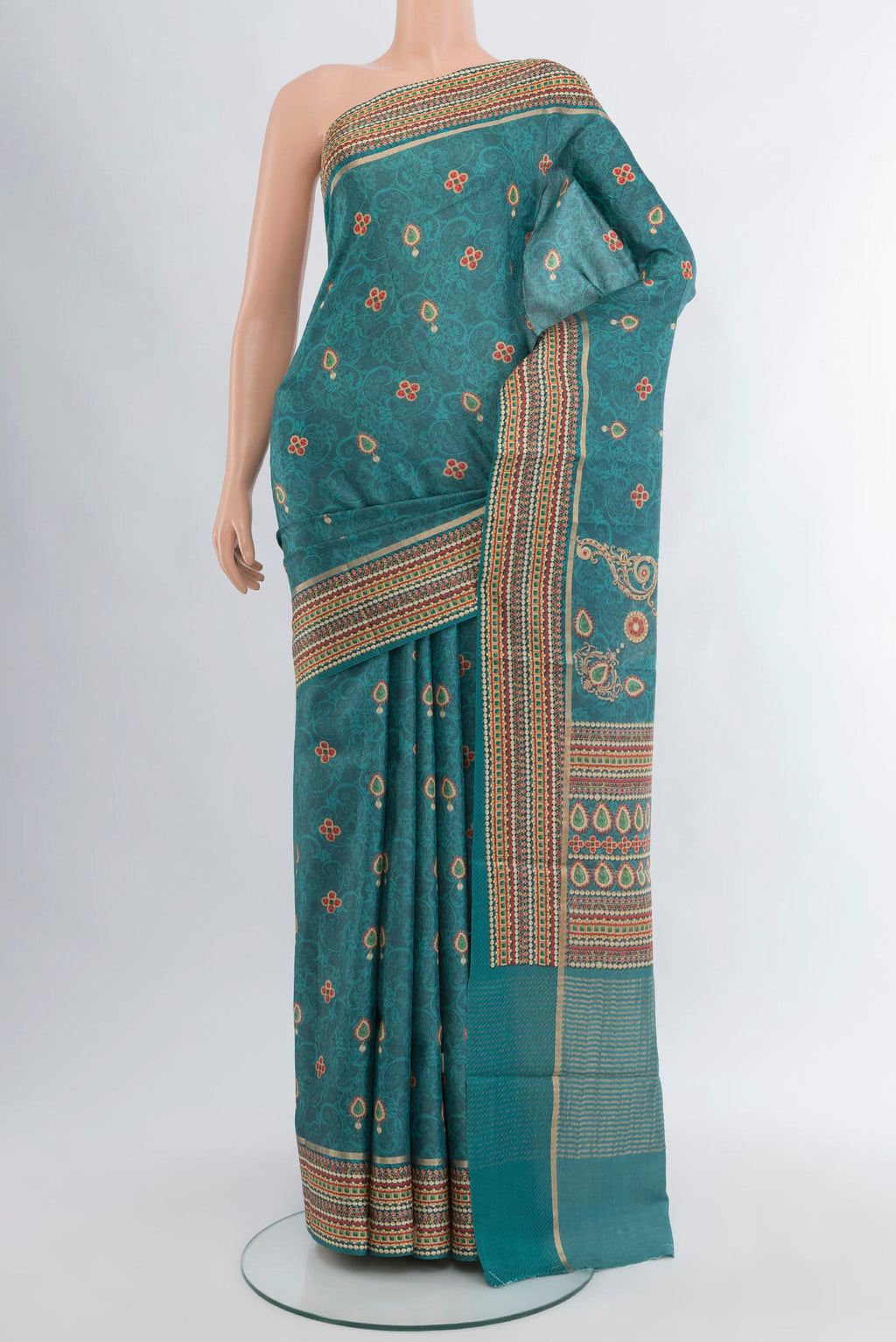 Blue Tussar Silk Saree with Floral Print on the body and Printed Border.  displayed on a mannequin