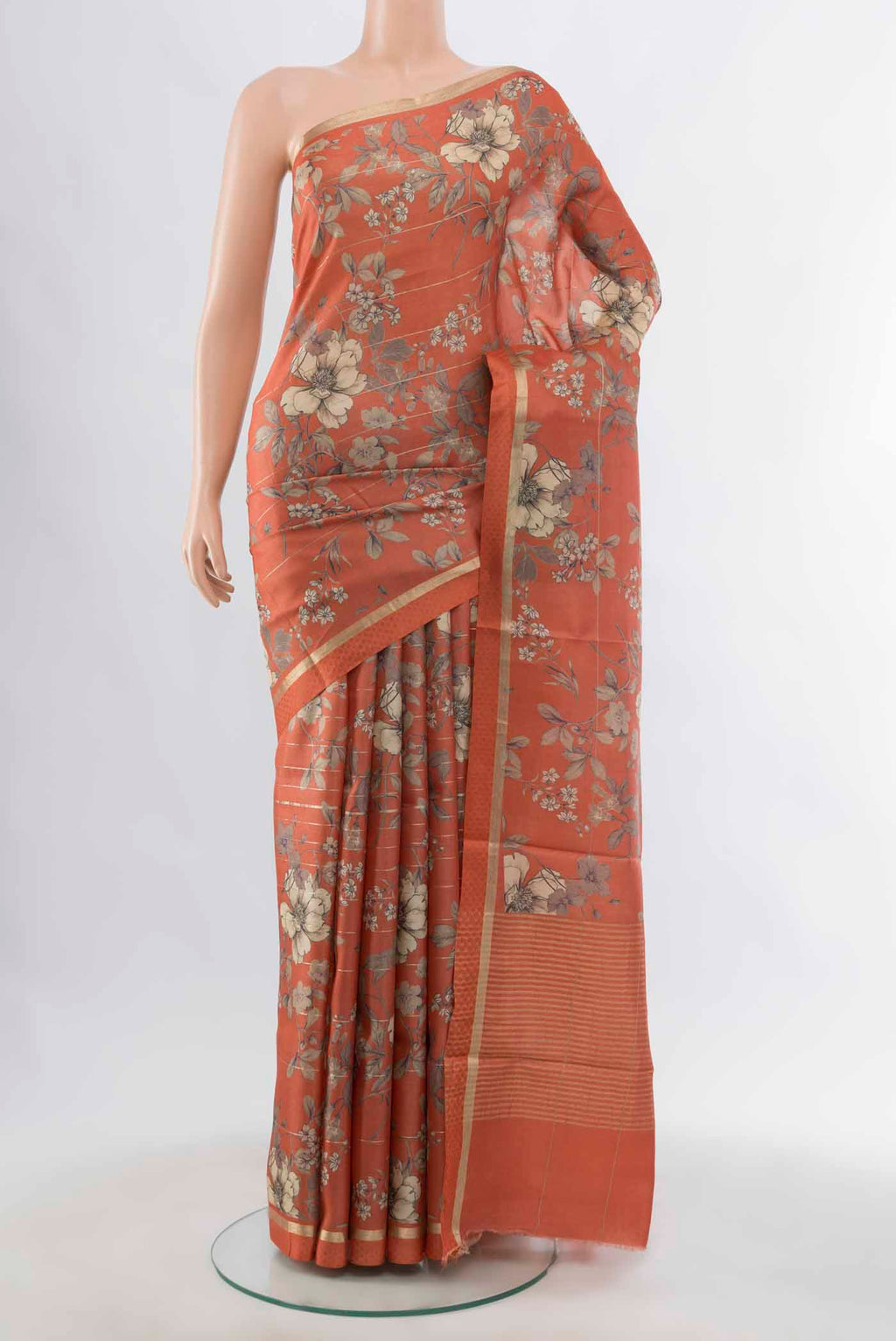 Brick Orange Tussar Silk Saree with Zari Butta on the body and Silk Border displayed on a mannequin