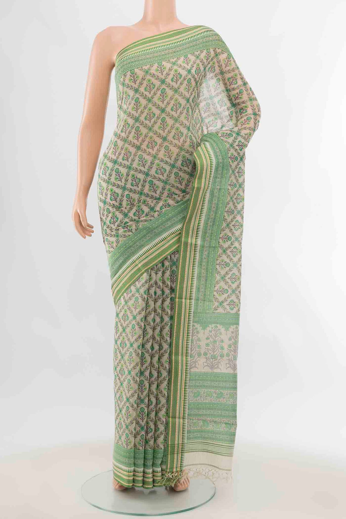 Light Green Maheshwari Silk Cotton Saree with Zari Butta on the body and Fancy Border displayed on a mannequin