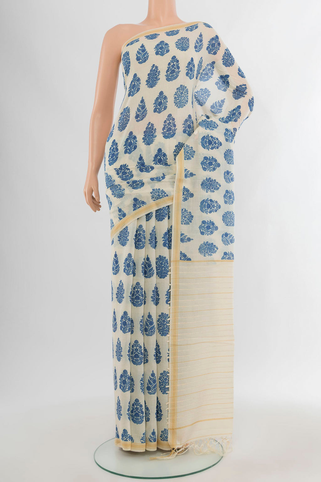 Cream Tussar Silk Saree with Floral Print on the body and Plain Border.  displayed on a mannequin