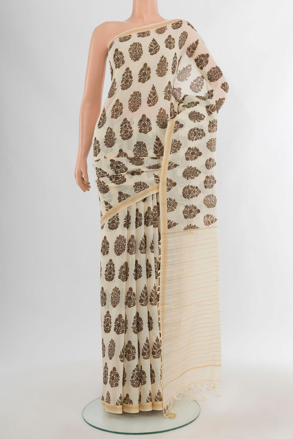 Beige Tussar Silk Saree with Floral Print on the body and Plain Border.  displayed on a mannequin