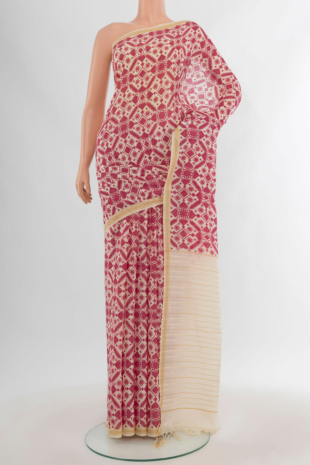 Pink Tussar Silk Saree with Floral Print on the body and Plain Border.  displayed on a mannequin