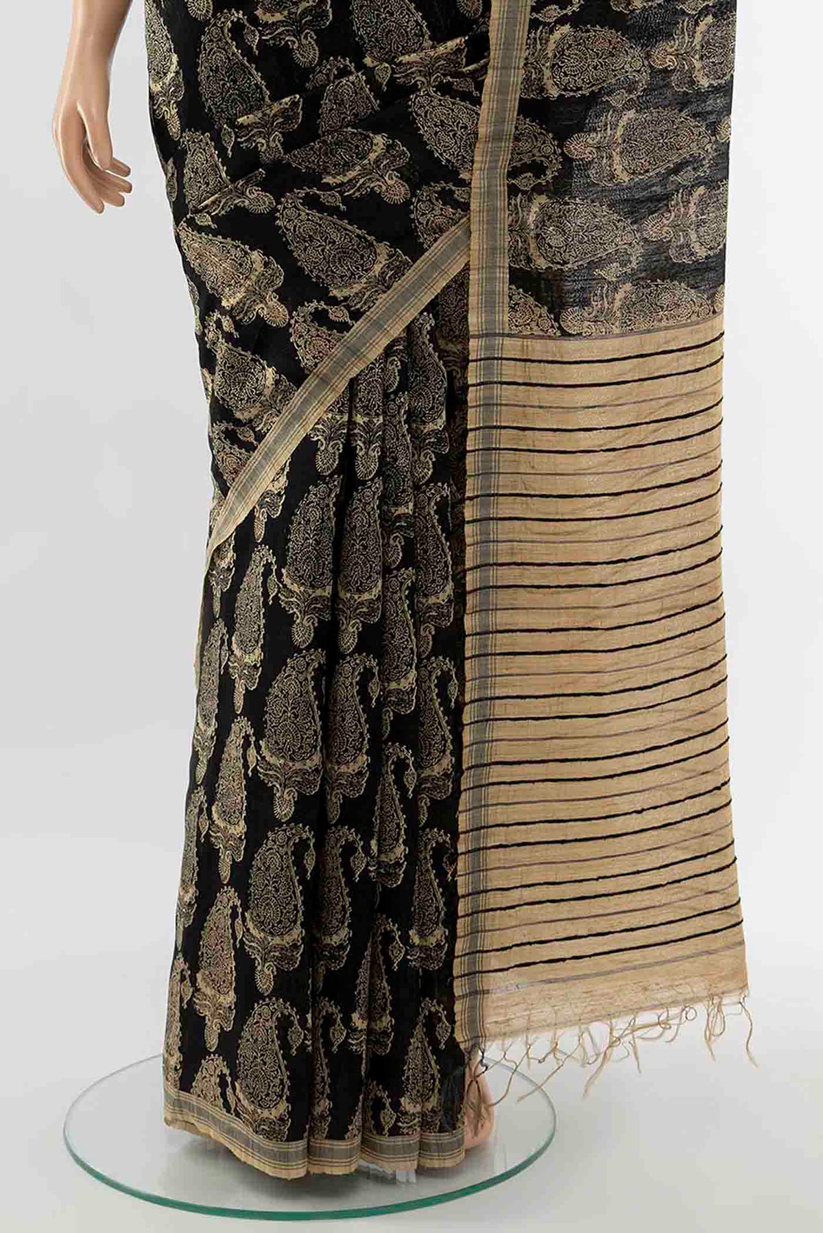Pleats and pallu of Black Tussar Silk Saree with Thread Butta on the body and Thread Border
