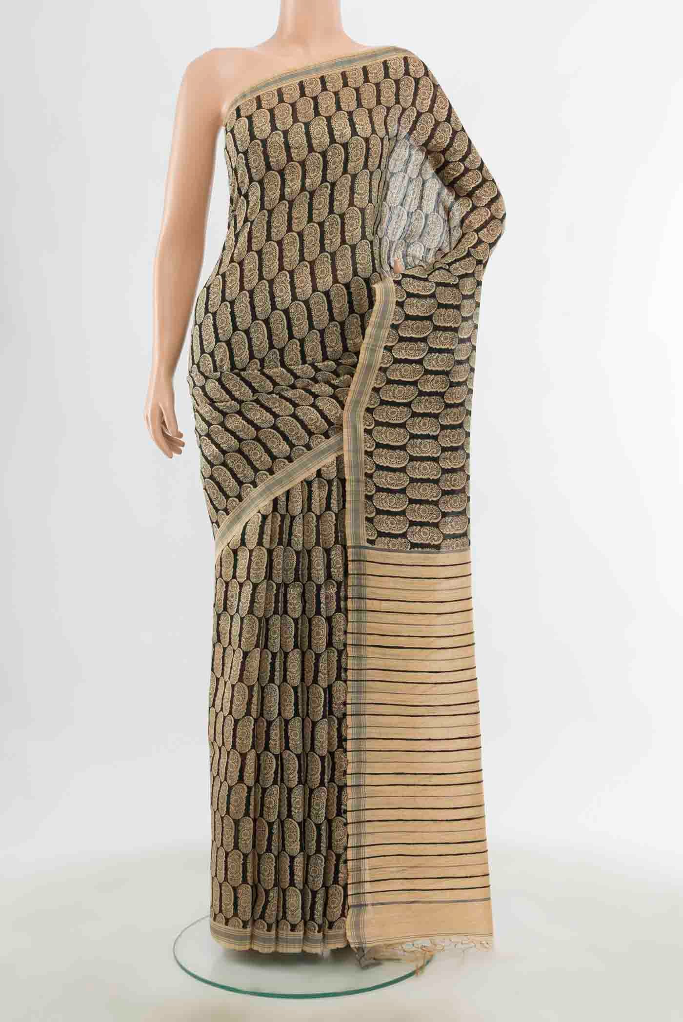 Black Tussar Silk Saree with Zari Butta on the body and Silk Border displayed on a mannequin