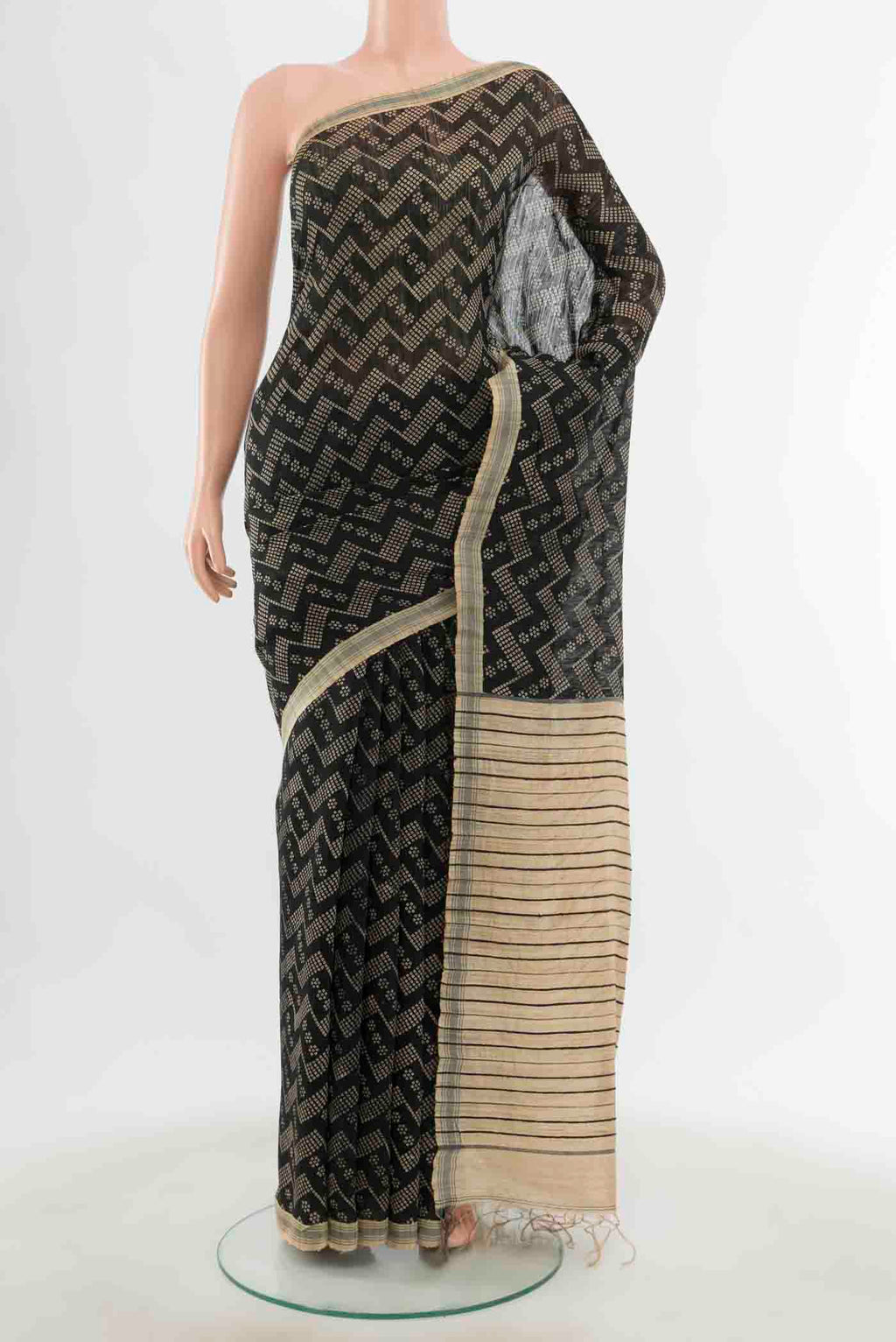 Black Tussar Silk Saree with Zari Butta on the body and Silk Border displayed on a mannequin