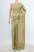 Pista Green Banarasi Silk Saree with Zari Brocade on the body and Silk Border.  displayed on a mannequin