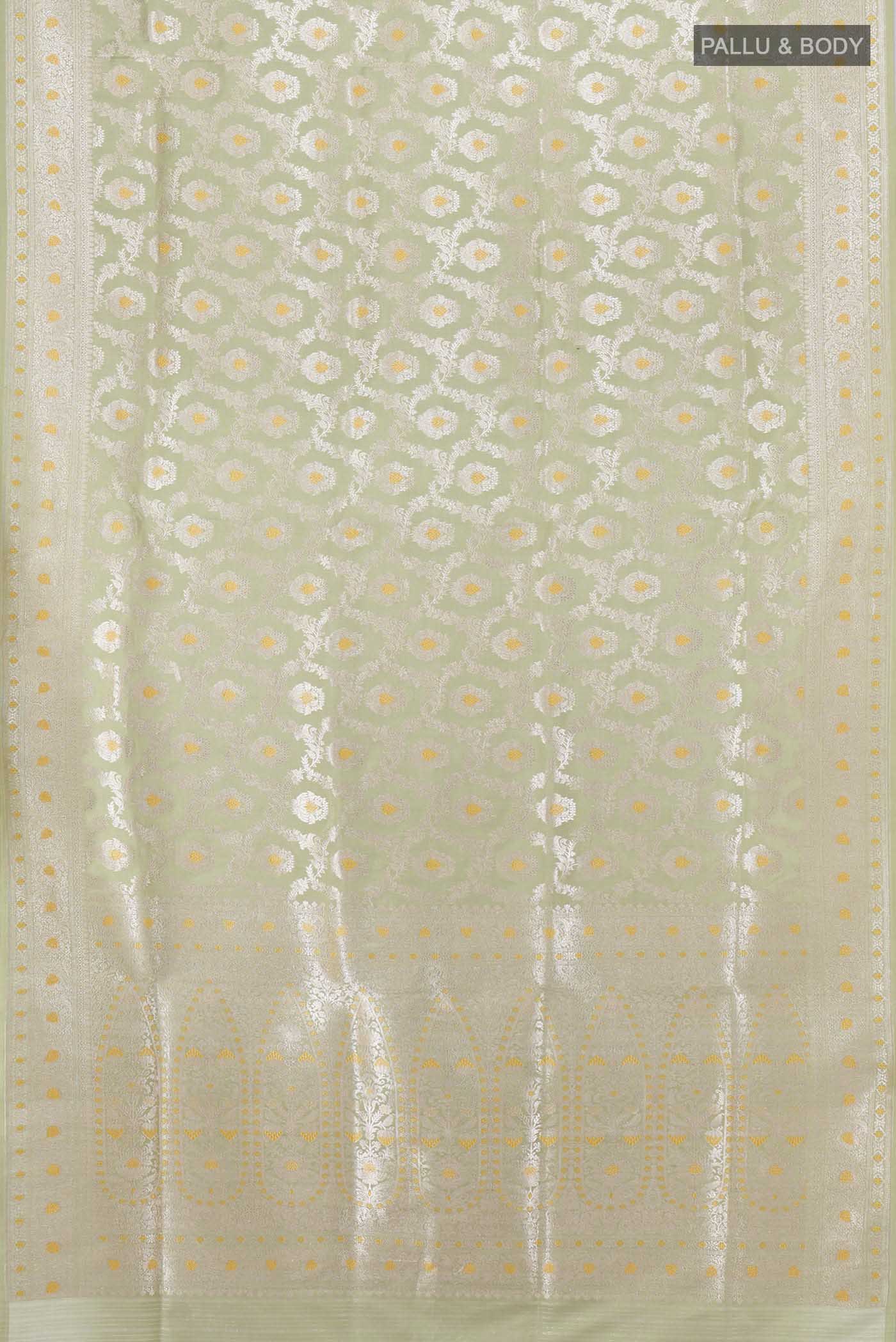 Flat view of Pista Green Banarasi Silk Saree with Zari Brocade on the body and Silk Border. 