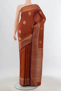 Bronze Kanjivaram Silk Saree with Zari Butta on the body and Silk Border.  displayed on a mannequin