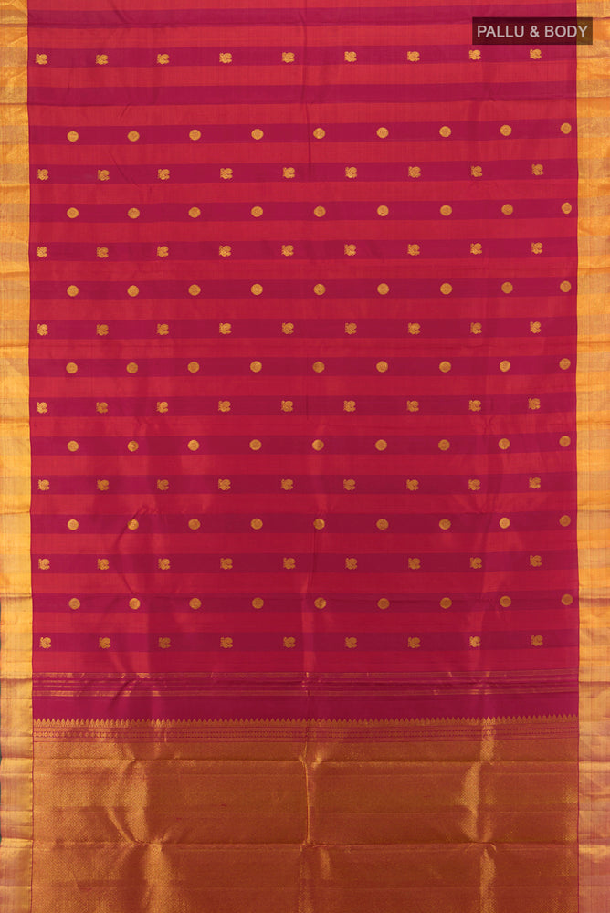 Flat view of Maroon Kanjivaram Silk Saree with Zari Brocade on the body and Silk Border. 