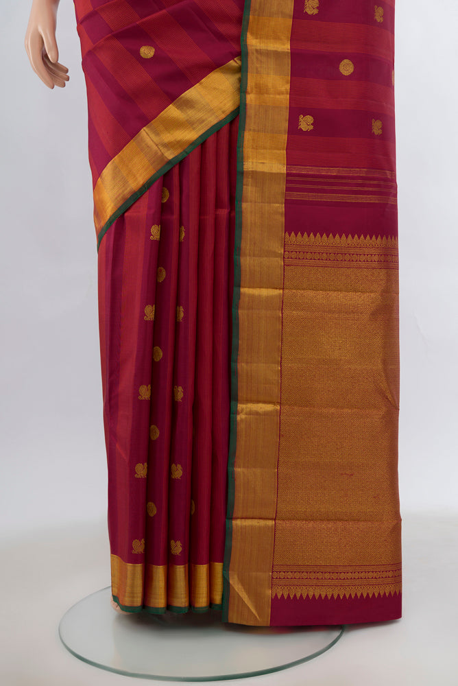 Pleats and pallu of Maroon Kanjivaram Silk Saree with Zari Brocade on the body and Silk Border. 
