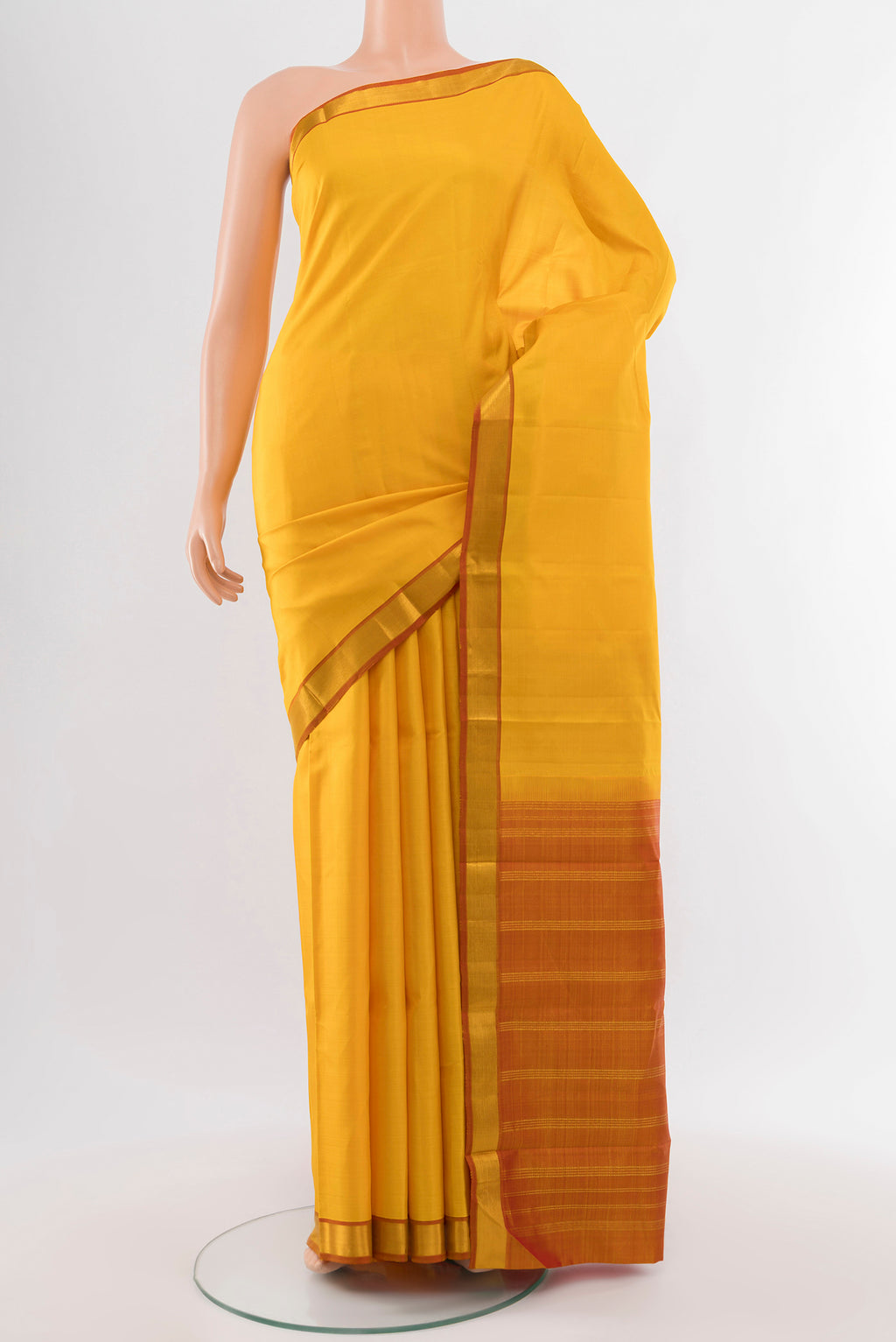 Pure Silk Pure Zari Yellow Kanjivaram Saree with Plain Body and Silk Border.  displayed on a mannequin